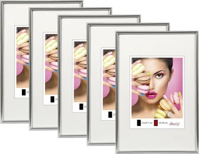 A set of silver picture frames with images of macarons and a woman.