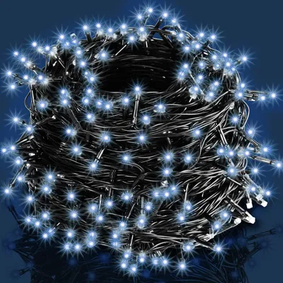 A tangled ball of white LED string lights against a dark blue background.