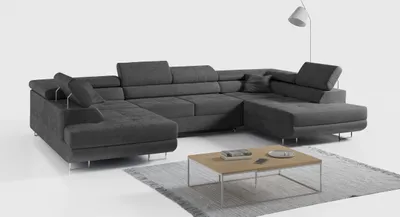 A dark gray sectional sofa is shown from a diagonal angle in a studio setting with a white background.