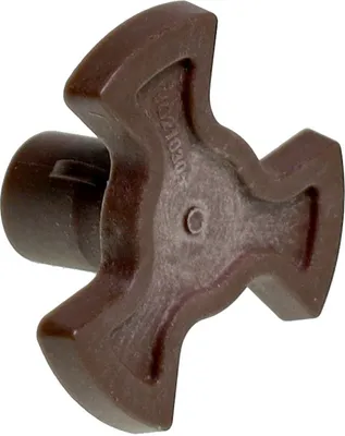 A close-up shot of a brown plastic drive cross for a microwave.