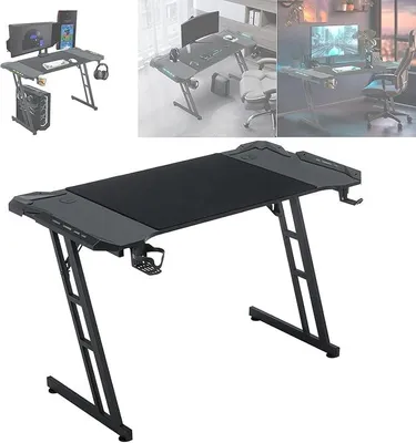 Imagen del producto de Mesa de juego de 140x60 cm con iluminación LED, escritorio ergonómico en forma de Z para ordenador, con soporte para auriculares, portavasos y diseño que imita la fibra de carbono. Escritorio para PC, portátil y juegos - color