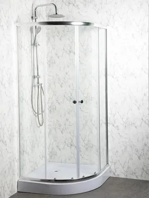 A modern shower cabin with a marble-patterned wall.