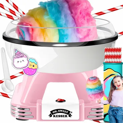 A pink and white cotton candy machine with rainbow-colored cotton candy, paper straws, a scoop, and a sticker of cute characters. A young girl is partially visible on the right, holding a stick with cotton candy.