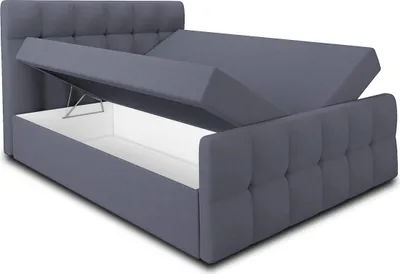 A grey upholstered bed frame with the storage compartment open, revealing the white interior.
