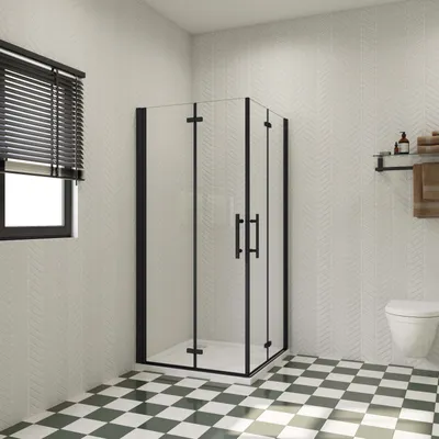 A modern bathroom with a black framed shower enclosure, a toilet, and a checkered floor.