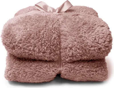 A folded fluffy blanket tied with a ribbon.