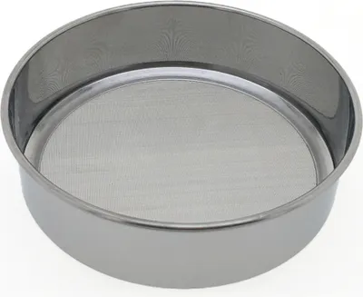 A close-up, studio shot of a stainless steel sieve.