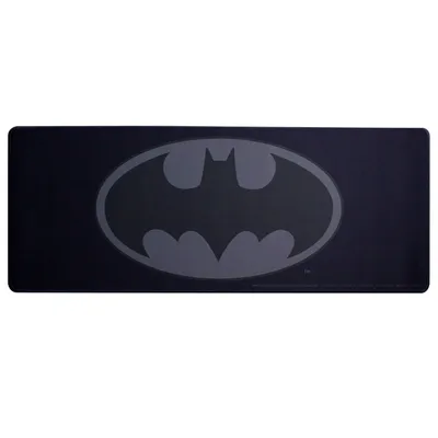 A black desk mat with a gray Batman logo.