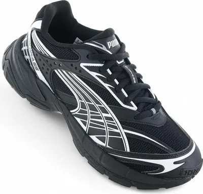 A black Puma sneaker with white accents, shown from a side angle on a white background.