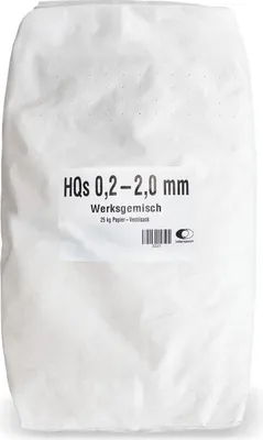 A white paper bag filled with granular material, with a label on the front.