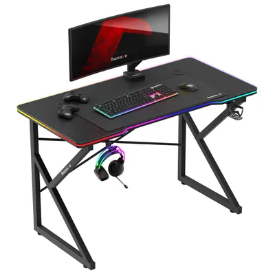 Zdjęcie produktu dla Huzaro Hero 1.7 | biurko gamingowe z oświetleniem LED | 120x60cm | haczyk na słuchawki uchwyt na kubek | powierzchnia z włókna węglowego | przelotka na kabel | czarny