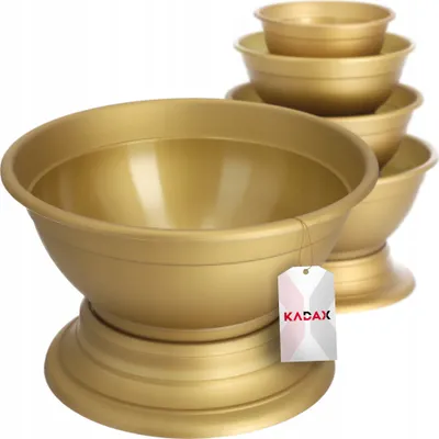 A stack of gold-colored plastic bowls of varying sizes, with the largest bowl in the foreground.