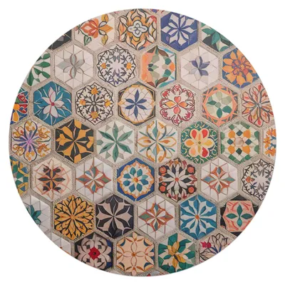 A circular mat with a mosaic pattern of colorful hexagonal tiles.