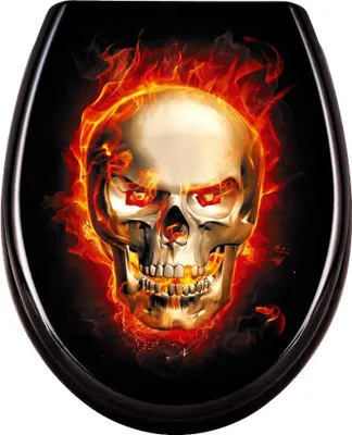 A toilet seat with a flaming skull design.