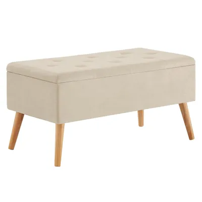 A beige upholstered storage bench with tufted top and wooden legs, shown against a white background.