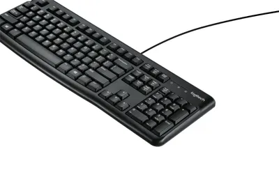 A black Logitech K120 keyboard is shown on a white background.