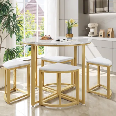 A round dining table with four triangular stools in a modern kitchen setting.