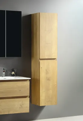 A bathroom vanity and tall cabinet against a gray wall.