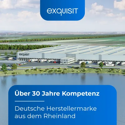 A large warehouse facility with trucks at loading docks, situated next to a body of water, with text overlays.