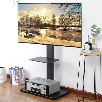 A TV stand with a TV mounted on it, placed against a white wall.