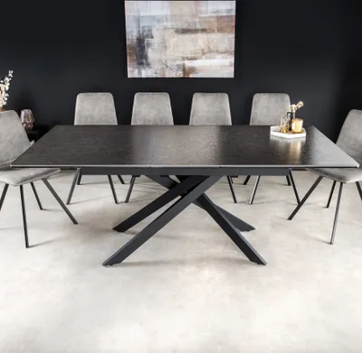 A dining table with chairs in a modern dining room setting.