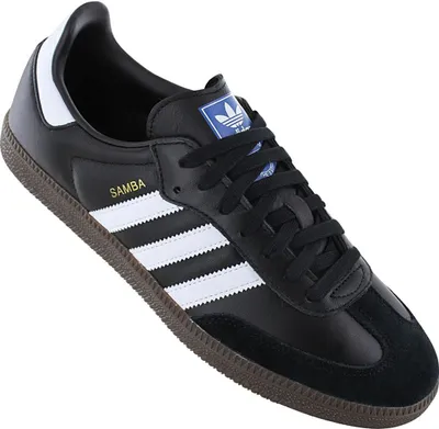 A black Adidas Samba OG shoe is shown against a white background.