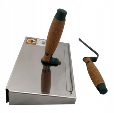 Two tools for masonry work are displayed on a white background. The larger tool is a trowel with a cork handle, and the smaller tool is a joint scraper with a similar cork handle.