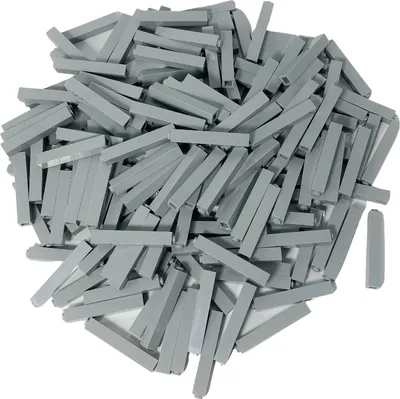 A pile of small, gray, rectangular building blocks.