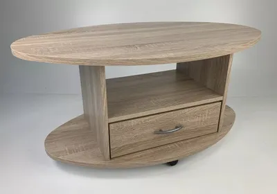 A light wood-tone oval coffee table with a drawer and shelf, shown against a white background.