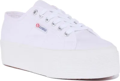 A white Superga platform sneaker is shown from a side angle against a white background.