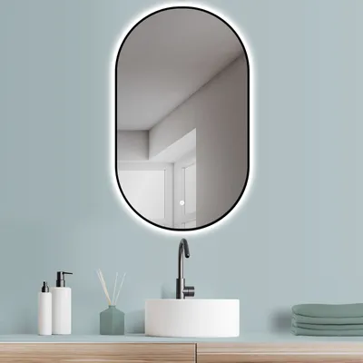 A bathroom vanity with a sink, faucet, and mirror.