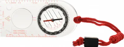 A close-up shot of a clear compass with a red cord attached.