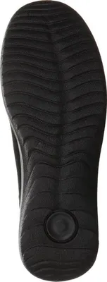 The sole of a black shoe is shown from an underneath view.