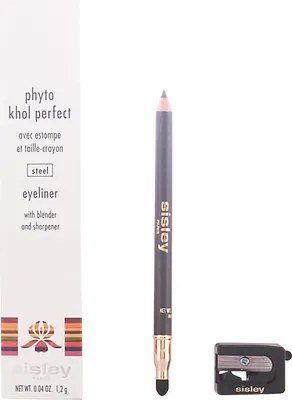 A product shot of an eyeliner pencil, its packaging, and a sharpener on a white background.