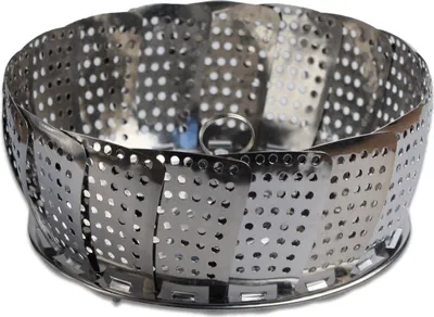 A stainless steel steamer basket with a white background.