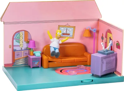 A toy playset depicting the living room of The Simpsons' house, with a Homer Simpson figure.