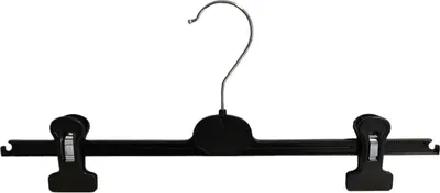 A black plastic hanger with two clips for hanging pants, against a white background.