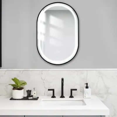 A modern bathroom vanity with a sink, faucet, mirror, and accessories.