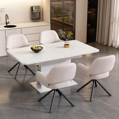 A dining set with a white rectangular table and four beige chairs in a modern kitchen setting.