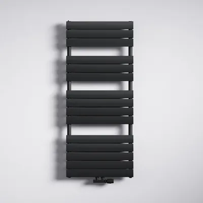 A black radiator is mounted on a white wall.