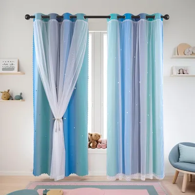 A room with blue gradient curtains with white tulle overlays, decorated with small white stars.