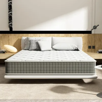 A mattress on a bed frame in a bedroom setting.