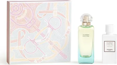 A gift set of Hermès perfume and lotion with decorative packaging.