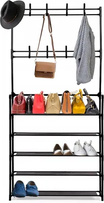 A black metal garment rack and shoe rack with several bags and shoes on it.