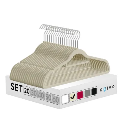 A stack of beige clothes hangers is displayed on top of a white box with product information.