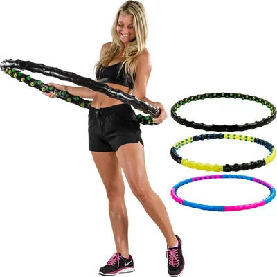 A woman is holding a hula hoop, with three other hula hoops displayed to the right.