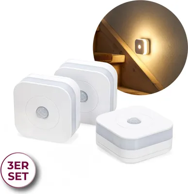 Three white LED night lights with motion sensors are displayed on a white background. A circular inset image shows one of the lights mounted on a wooden staircase, illuminating the steps.