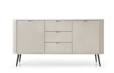 A front view of a beige sideboard with fluted doors and drawers, standing on black legs, against a white background.