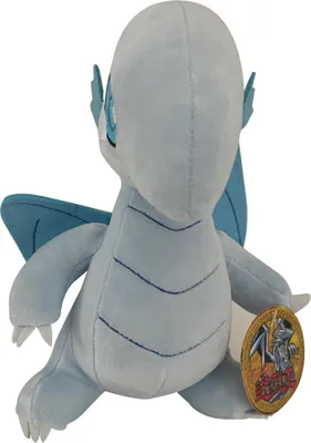 A plush toy of a blue-eyed white dragon from Yu-Gi-Oh! is shown from the back, sitting down.