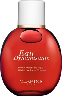 A product shot of a red bottle of Clarins Eau Dynamisante.